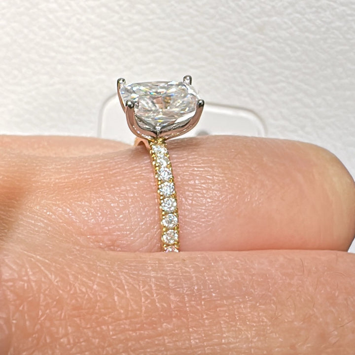8x6mm radiant moissanite engagement ring with moissanite band in 14K gold.