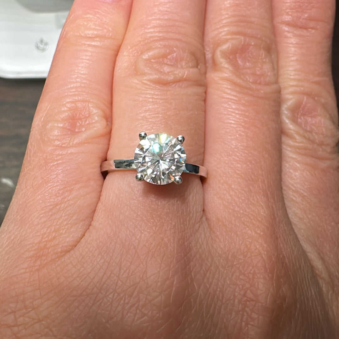 1.67CT Charles & Colvard moissanite ring with hidden diamond halo, set in 14K gold.