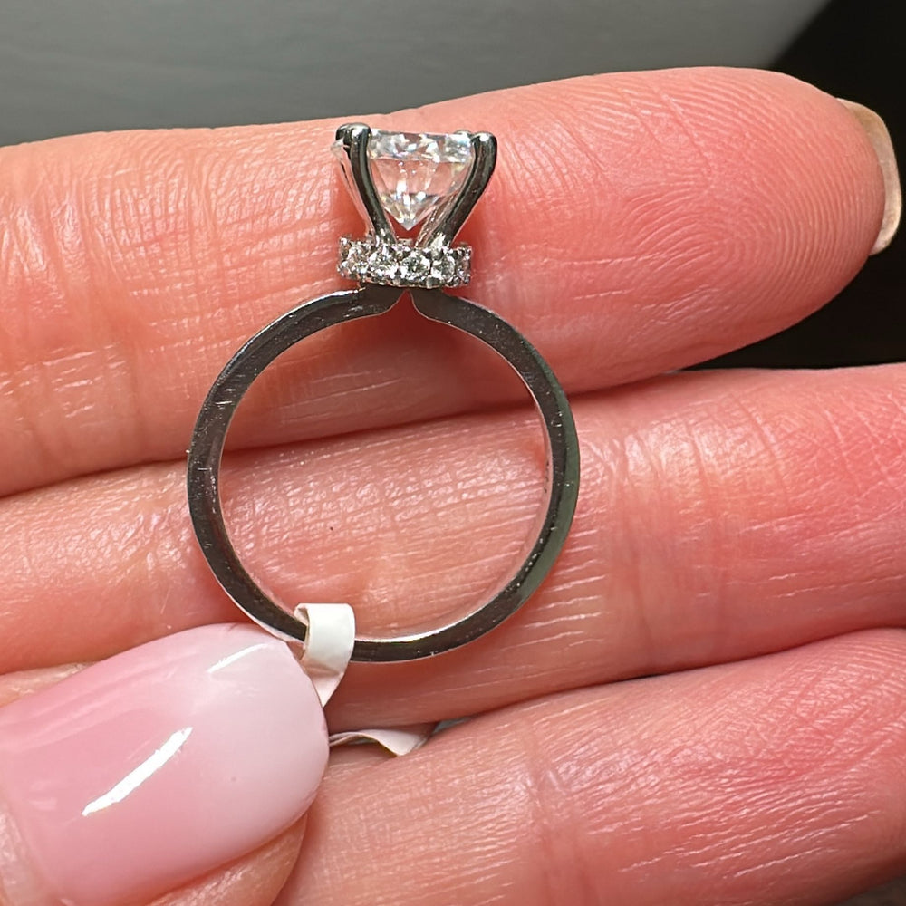 1.67CT Charles & Colvard moissanite ring with hidden diamond halo, set in 14K gold.