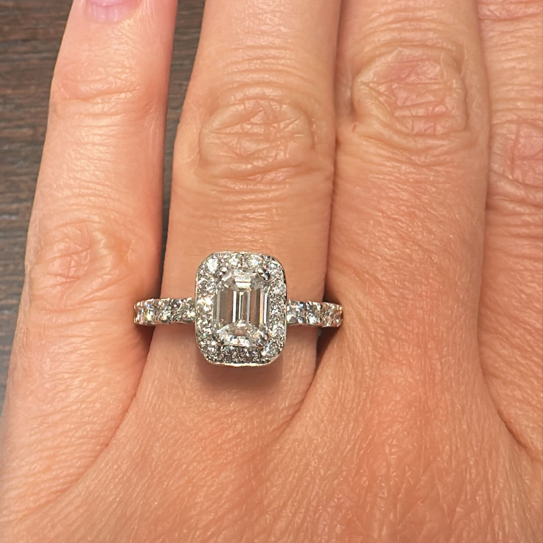 1.03 CT emerald-cut diamond halo engagement ring in 14K white gold with natural diamond accents.