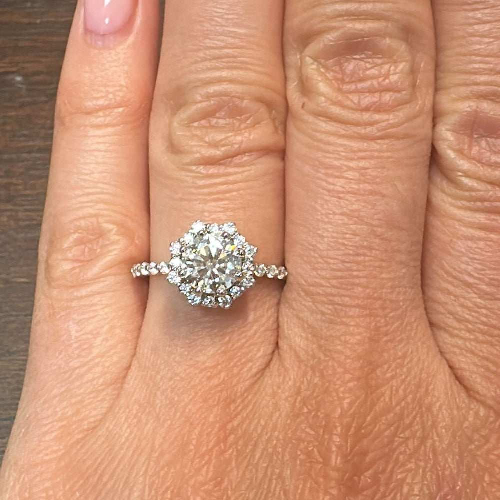 1 CT round moissanite halo engagement ring with moissanite accents in 14K white gold.