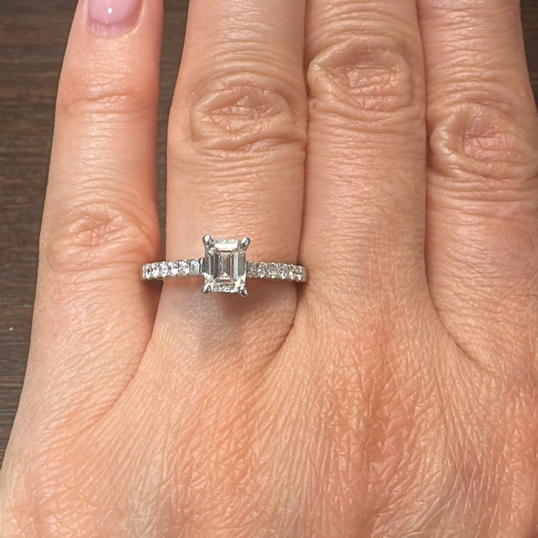 0.66 CT emerald cut lab-grown diamond ring with accent diamonds in 14K white gold.