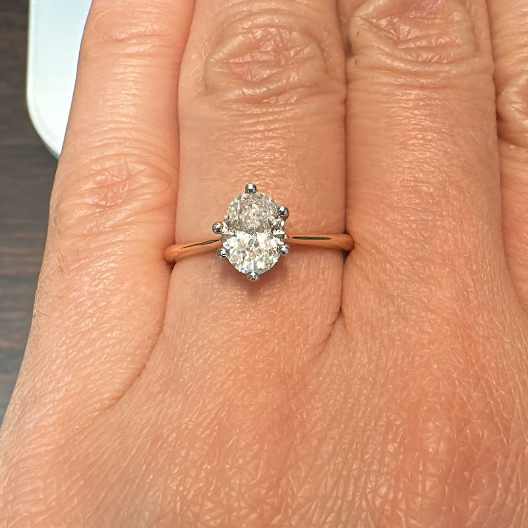 0.88 CT oval lab-grown diamond solitaire ring in 10K rose gold.