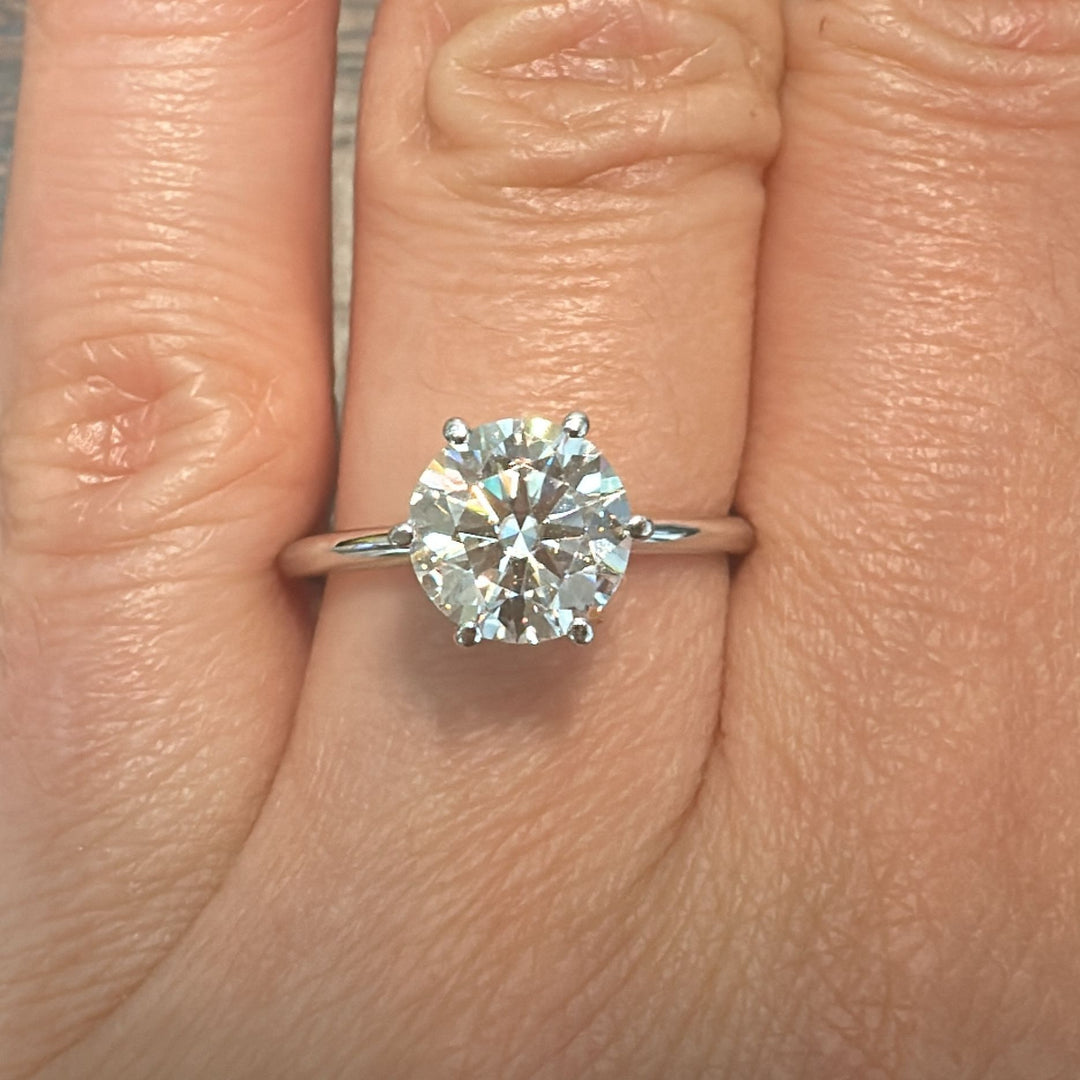 1.60 CT round moissanite solitaire ring in 14K white gold.