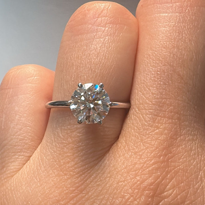 1.60 CT round moissanite solitaire ring in 14K white gold.