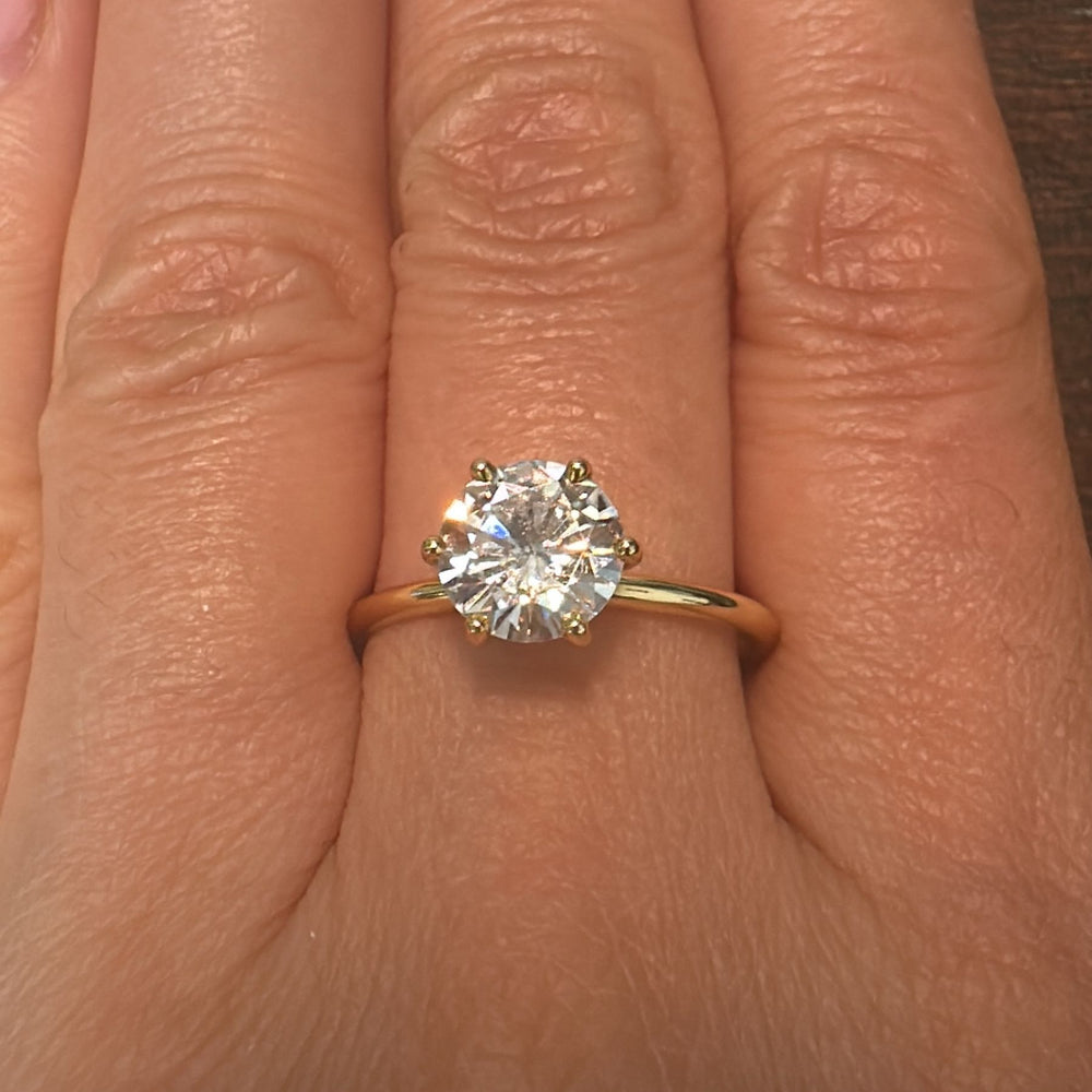 1.60 CT round moissanite solitaire ring in 14K white gold.