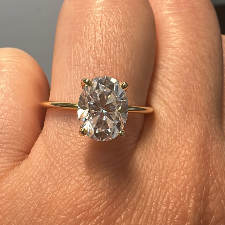 2.5 CT oval moissanite solitaire ring in 14K gold.