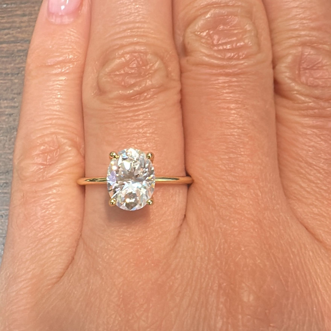 2.5 CT oval moissanite solitaire ring in 14K gold.