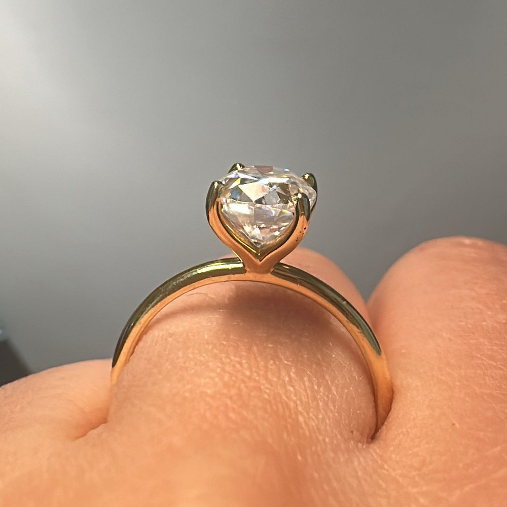 2.5 CT oval moissanite solitaire ring in 14K gold.