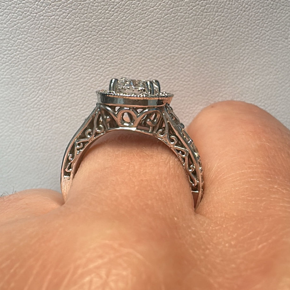 1.02 CT lab-grown diamond halo engagement ring in 14K white gold.