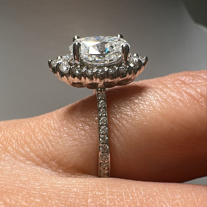 2.5 CT oval moissanite halo engagement ring in 14K gold with small moissanites.