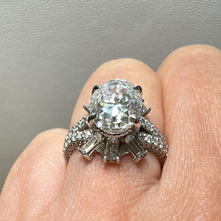 3 CT oval moissanite engagement ring in 14K gold with emerald-cut moissanites.