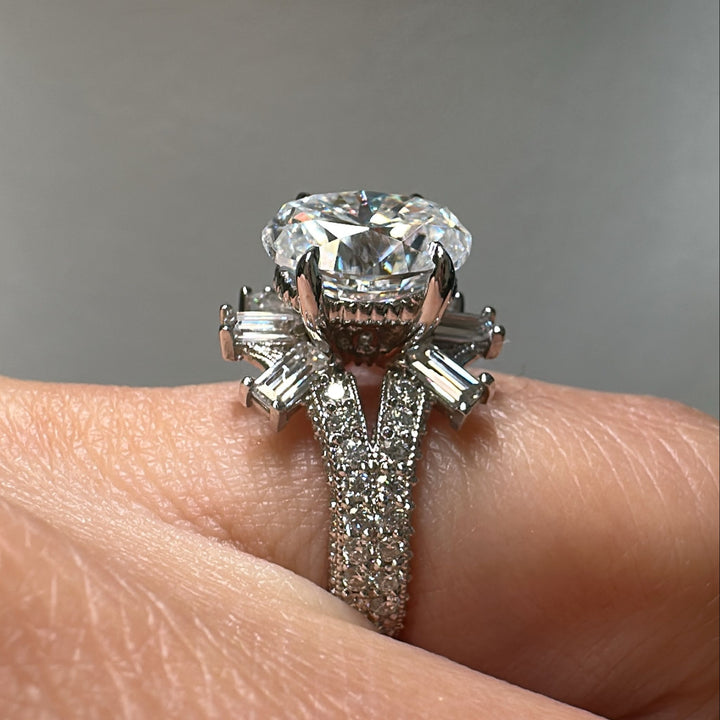 3 CT oval moissanite engagement ring in 14K gold with emerald-cut moissanites.
