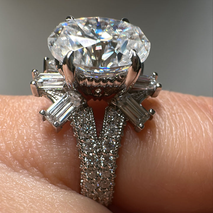 3 CT oval moissanite engagement ring in 14K gold with emerald-cut moissanites.