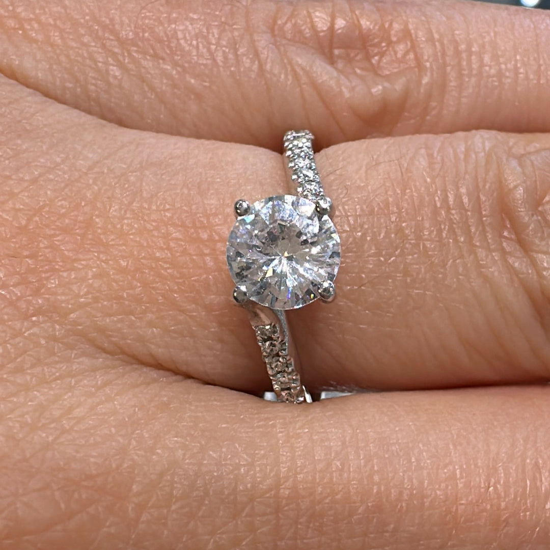 0.80 CT round moissanite engagement ring with diamonds in 14K gold.