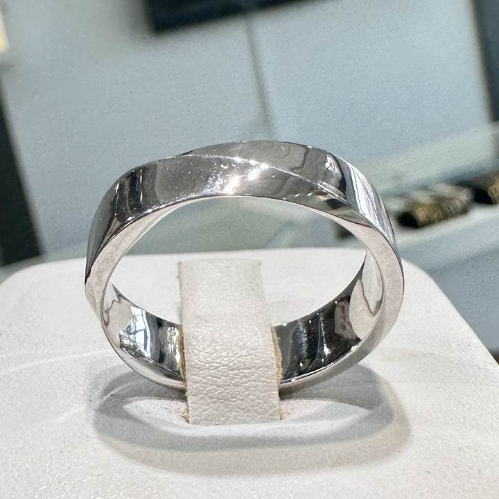 6mm 10K white gold men's wedding band with high-polish finish on display