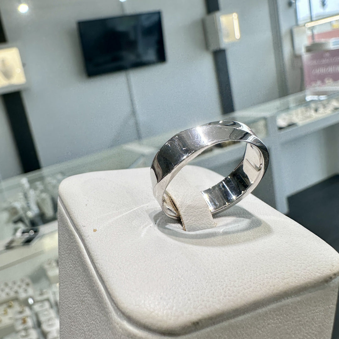 6mm 10K white gold men's wedding band with high-polish finish on display