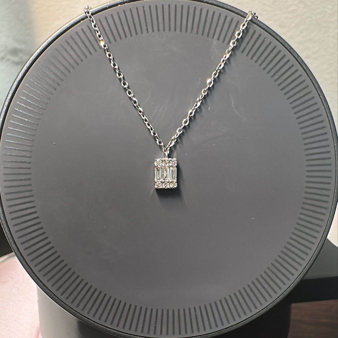 14K white gold necklace with emerald-cut diamond pendant and adjustable chain