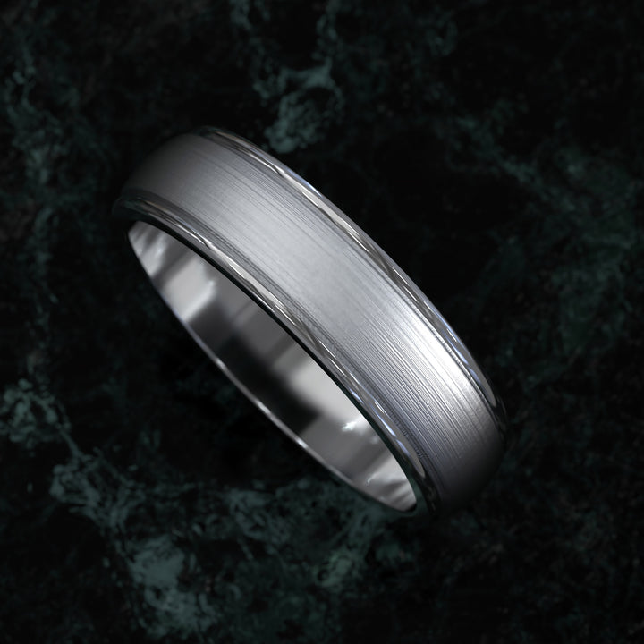 Brushed center domed men’s wedding band with rounded edges