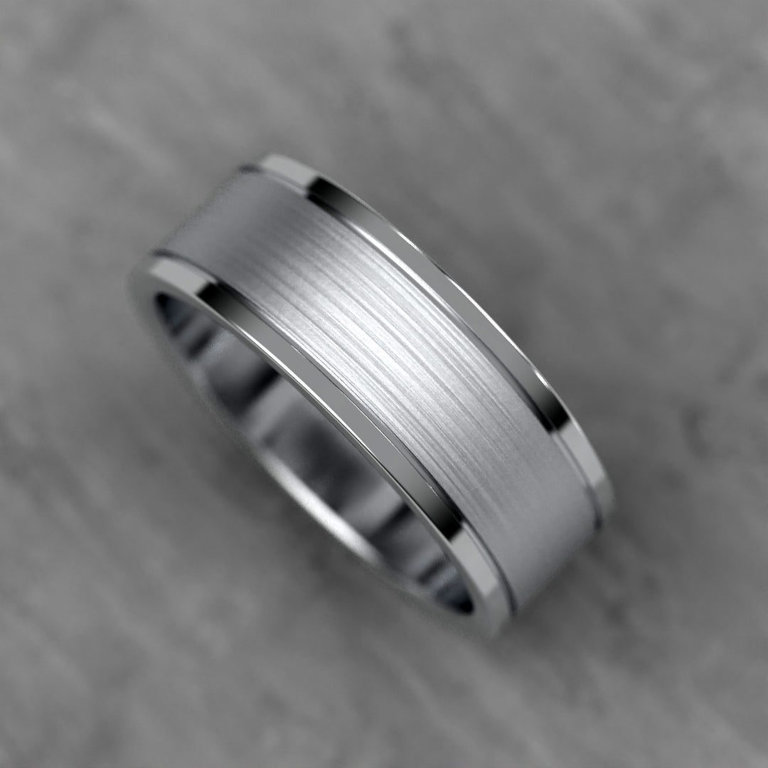 Center brushed men’s wedding band with polished double grooves