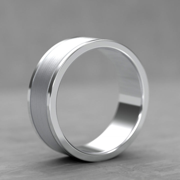 Center brushed men’s wedding band with polished double grooves