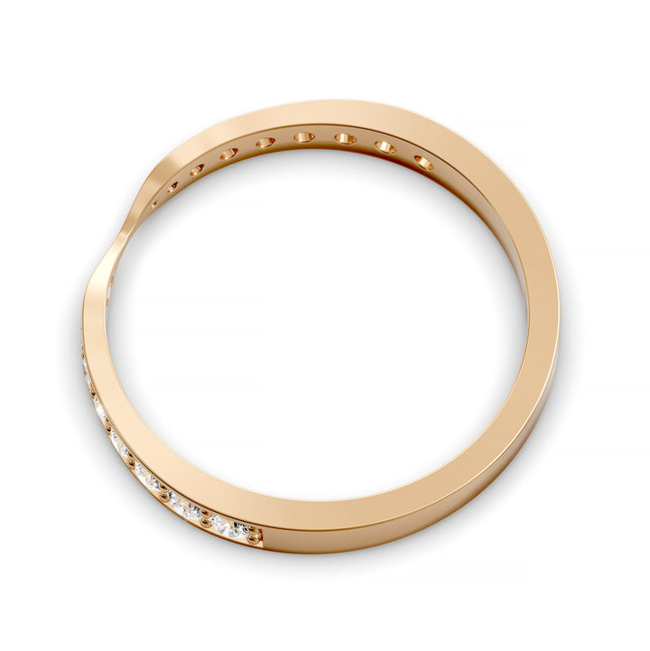 Channel set gold wedding band with tapered top and round brilliant stones