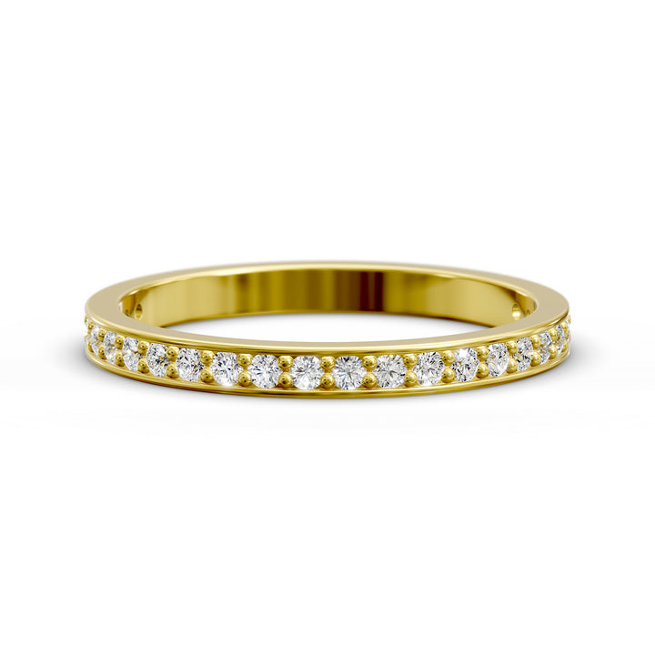 Channel set three-quarter eternity ring with round stones in polished gold