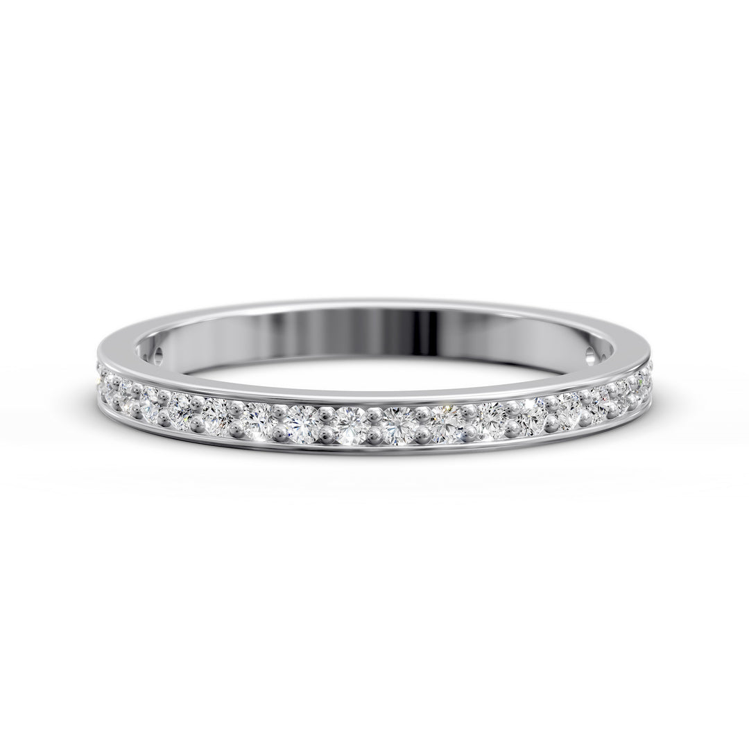 Channel set three-quarter eternity ring with round stones in polished gold