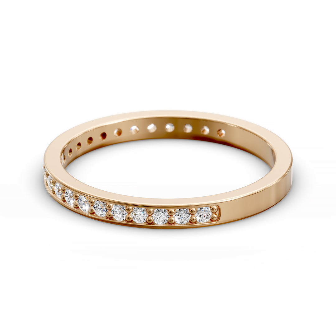 Channel set three-quarter eternity ring with round stones in polished gold