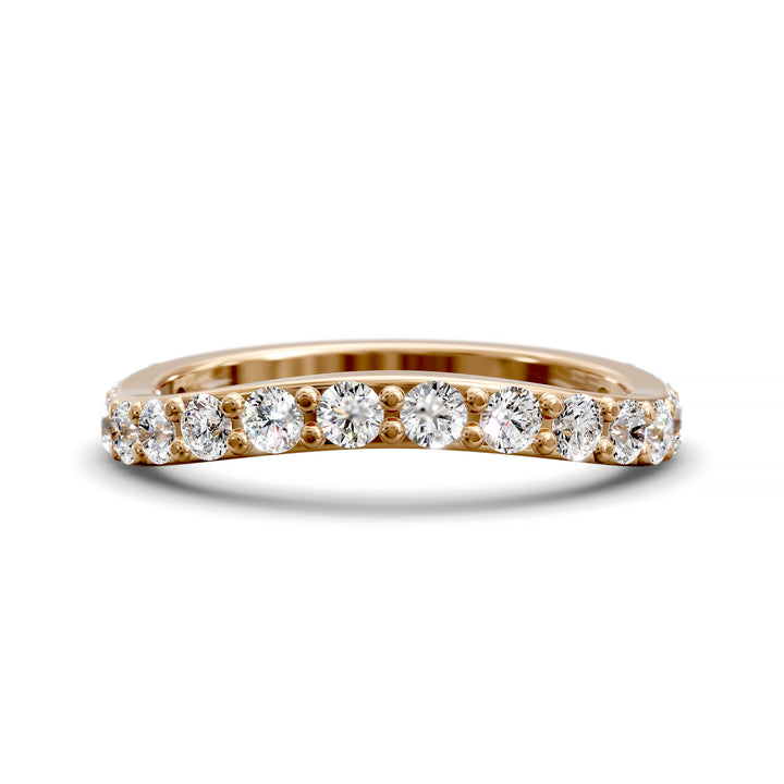 Curved half eternity diamond band with prong set round stones in polished gold
