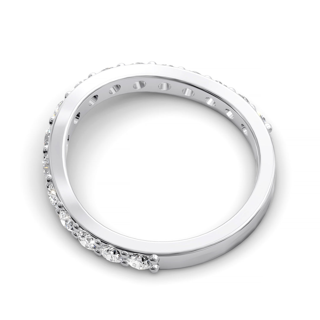 Curved half eternity diamond band with prong set round stones in polished gold