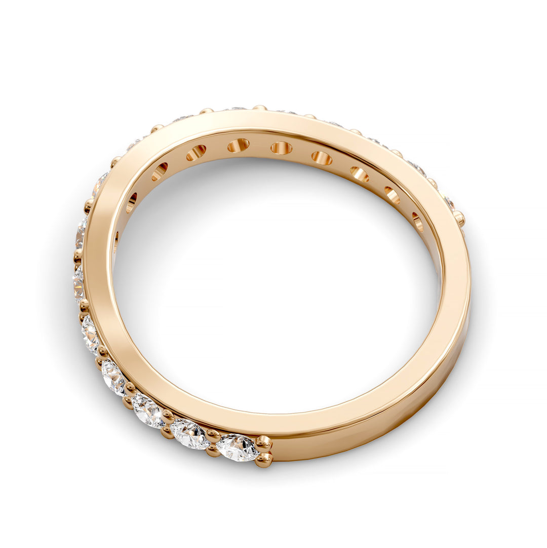 Curved half eternity diamond band with prong set round stones in polished gold