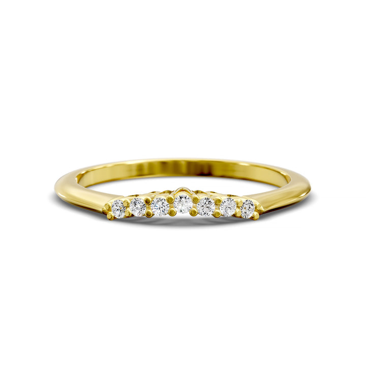 Curved diamond wedding band with shared-prong setting and open gallery, featuring seven round stones