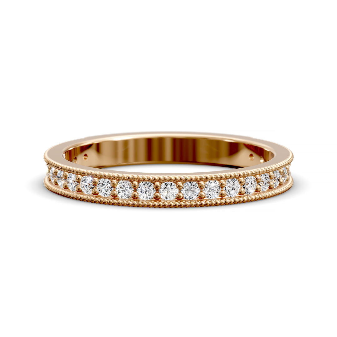 Channel set diamond wedding band with three-quarter eternity and beaded edge