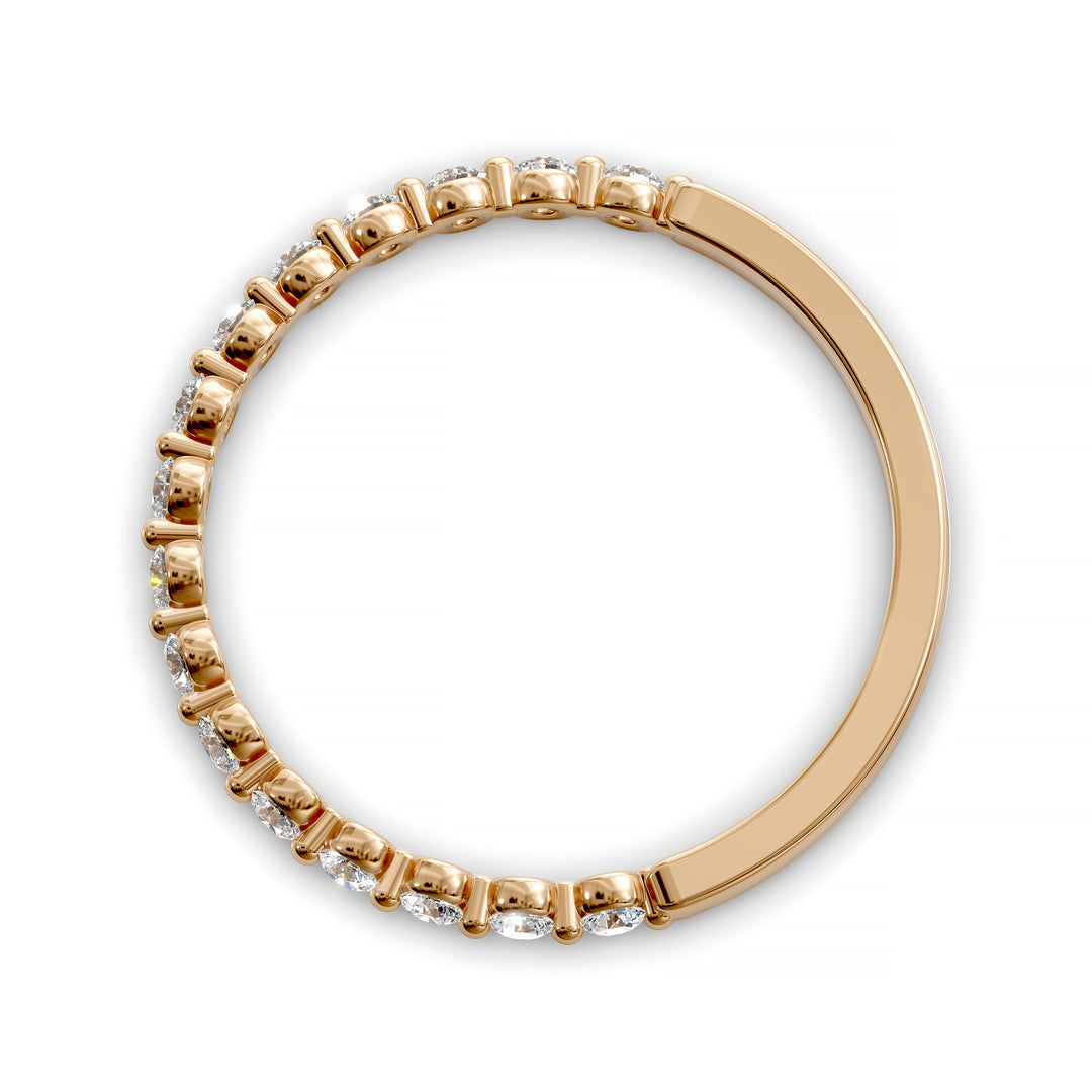 Floating diamond shared prong wedding band with round stones in gold