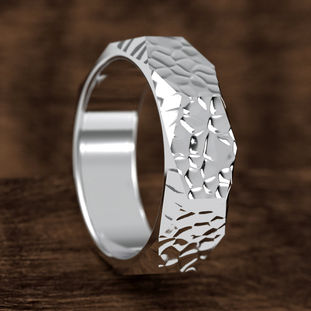 hammered hexagonal men’s wedding band with faceted texture