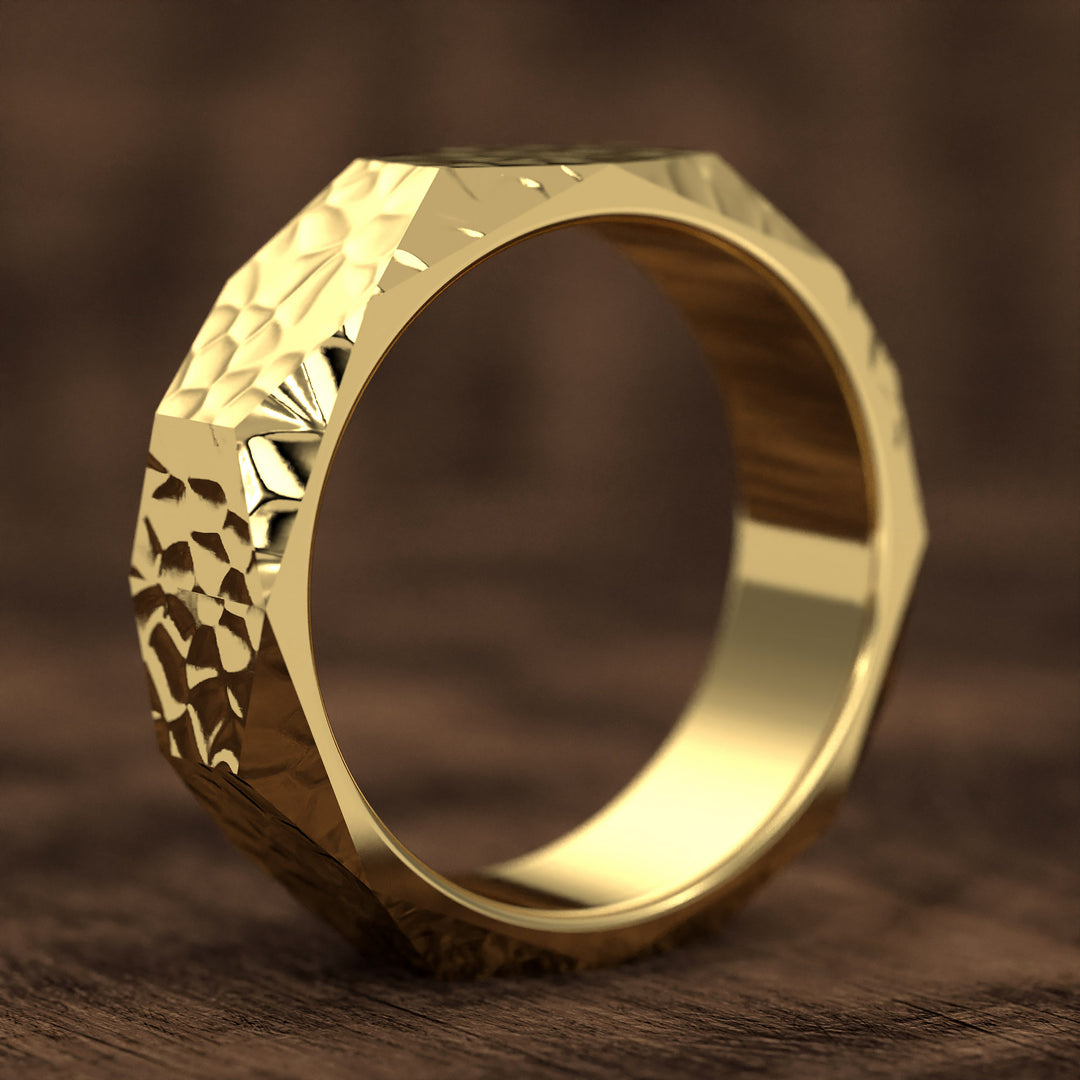hammered hexagonal men’s wedding band with faceted texture