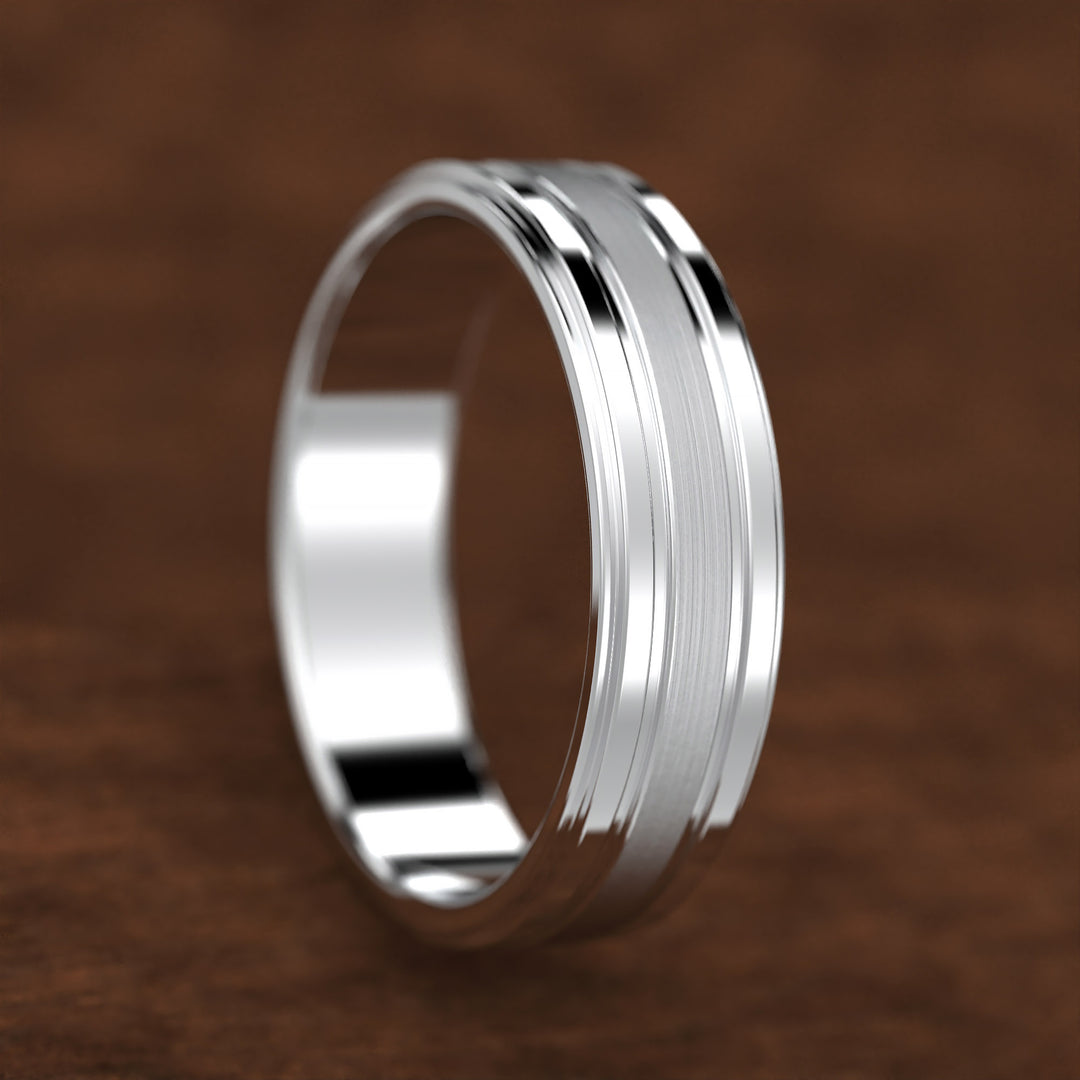men’s band with ice-cut textured center and polished dual grooves