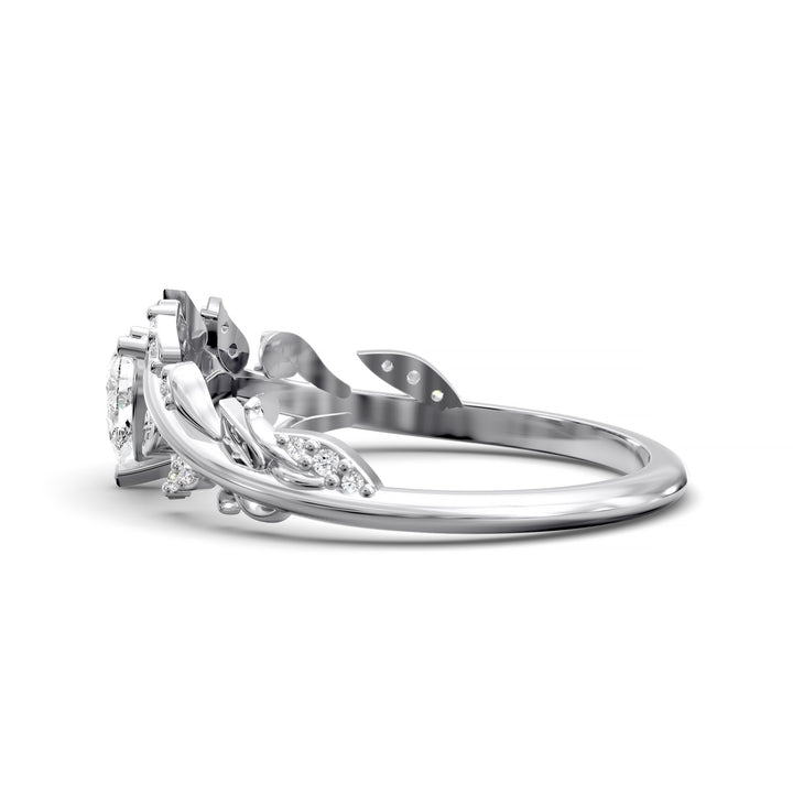 Leaf and vine wedding band with pear-shaped center stone and small accent stones