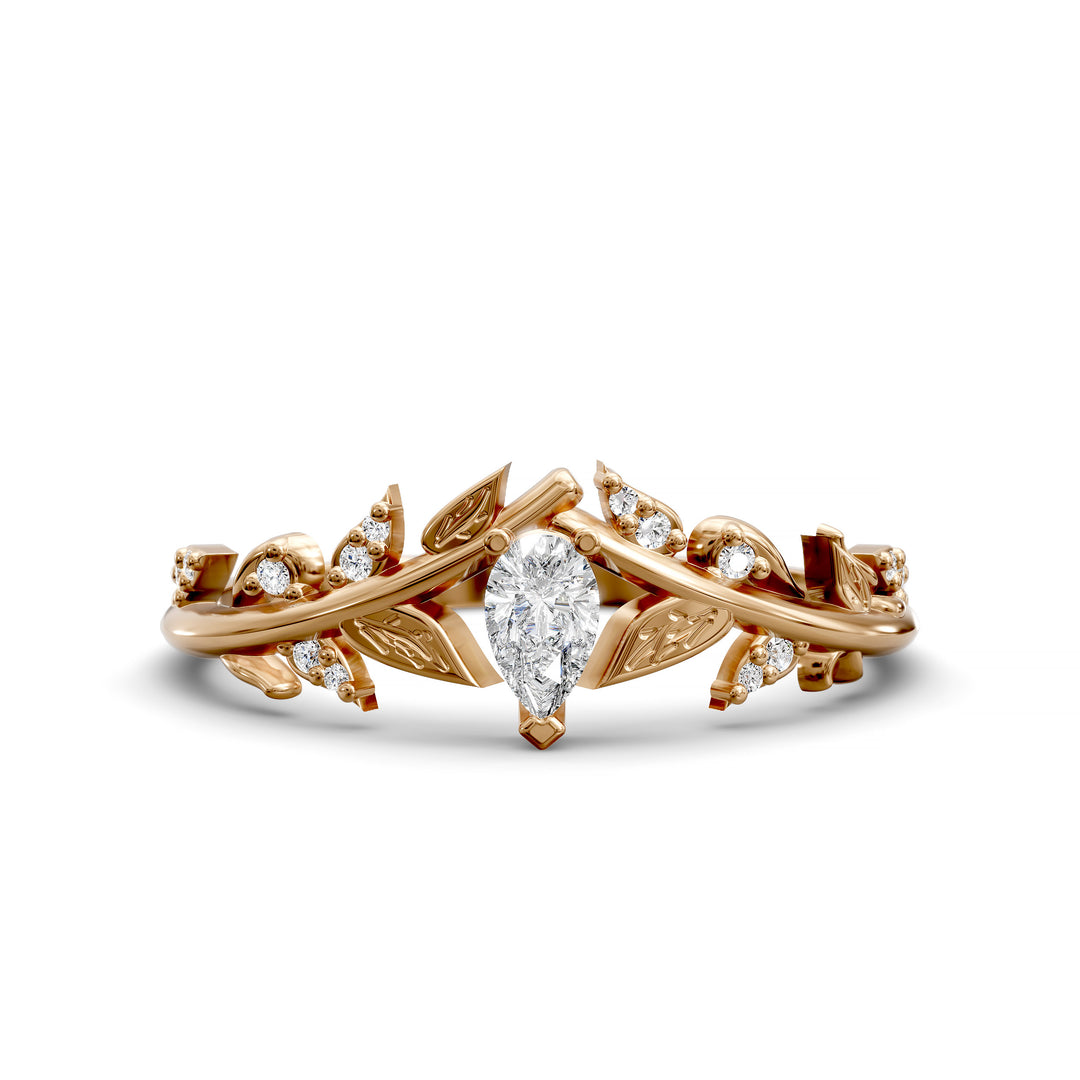 Pear-shaped wedding ring with leaf and vine design in a curved V-shaped band