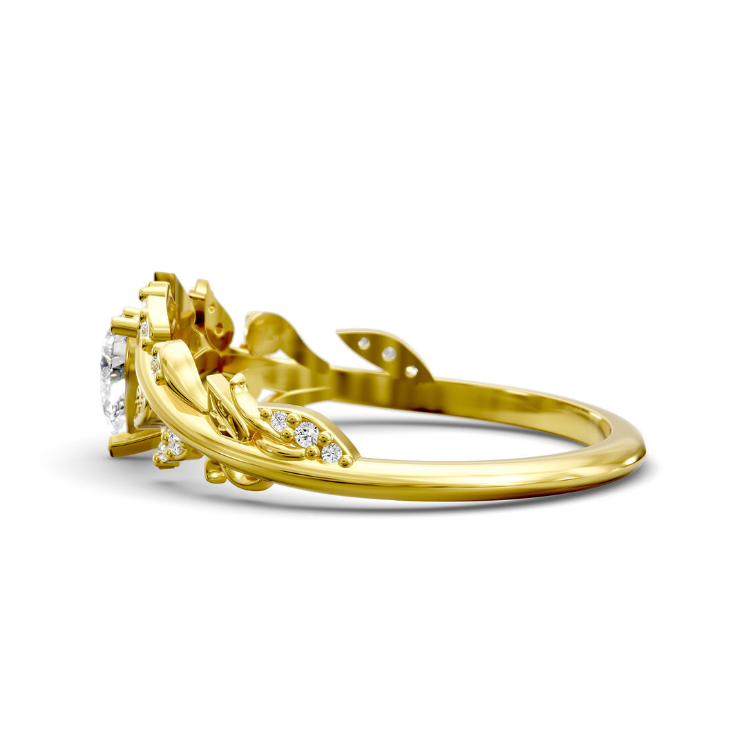 Leaf and vine wedding band with pear-shaped center stone and small accent stones