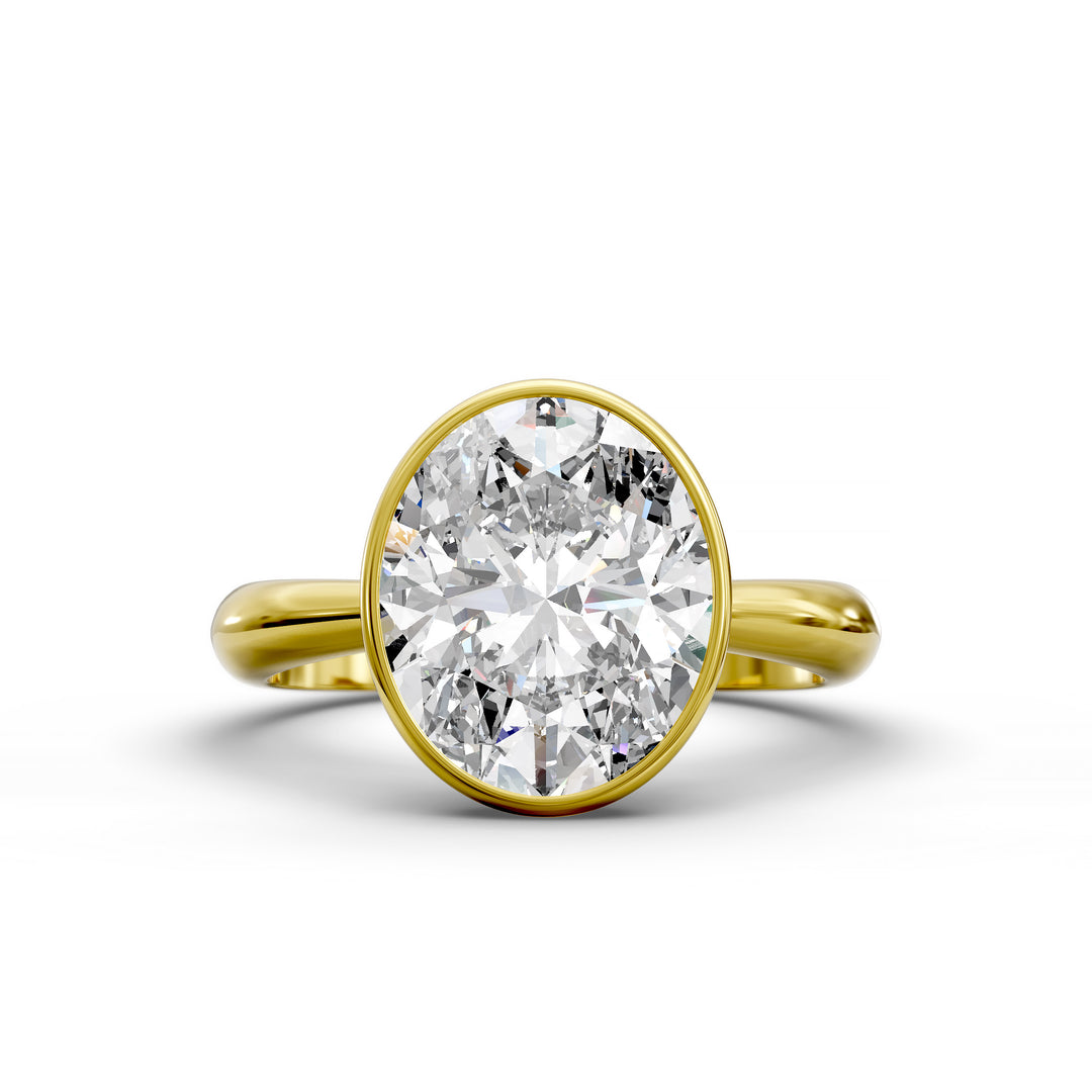 Oval bezel vintage diamond engagement ring with polished band in studio view.