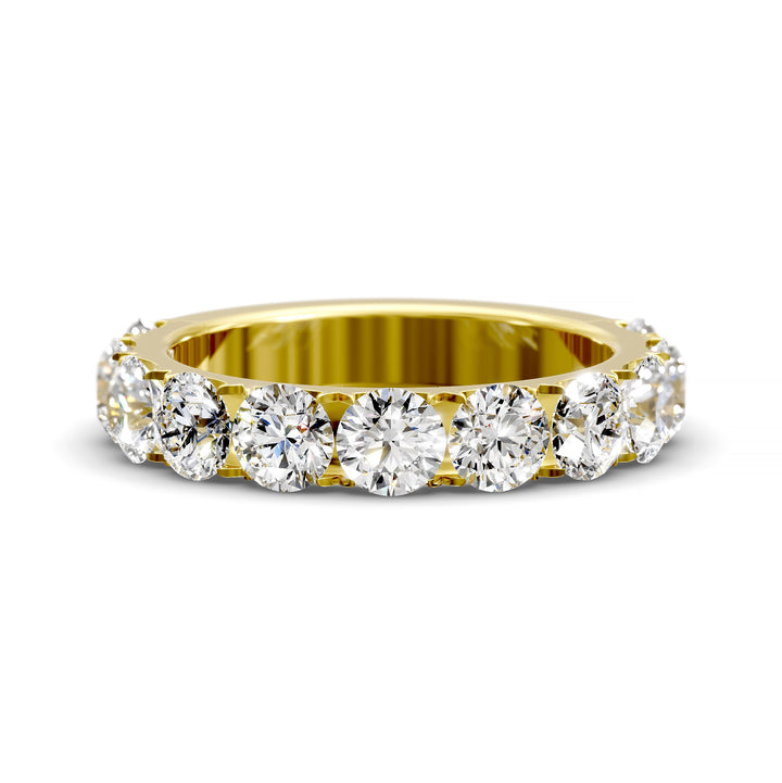 Wide gold pavé band with large round brilliant diamonds in eternity style