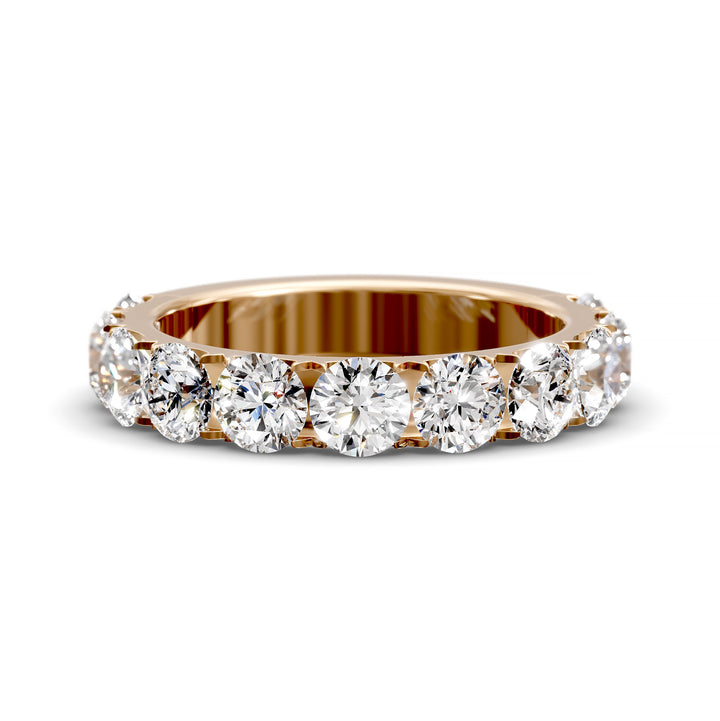Wide gold pavé band with large round brilliant diamonds in eternity style