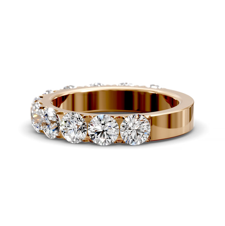 Wide gold pavé band with large round brilliant diamonds in eternity style