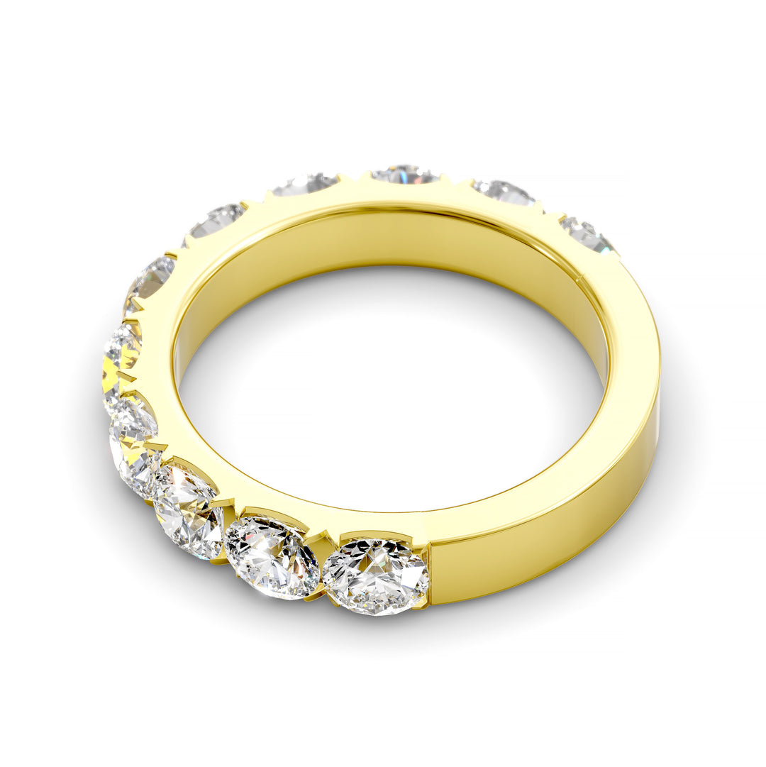 Wide gold pavé band with large round brilliant diamonds in eternity style