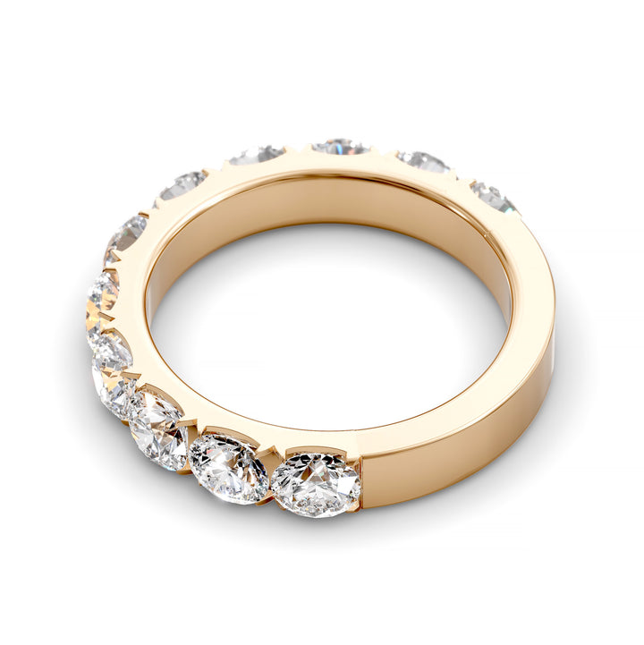Wide gold pavé band with large round brilliant diamonds in eternity style
