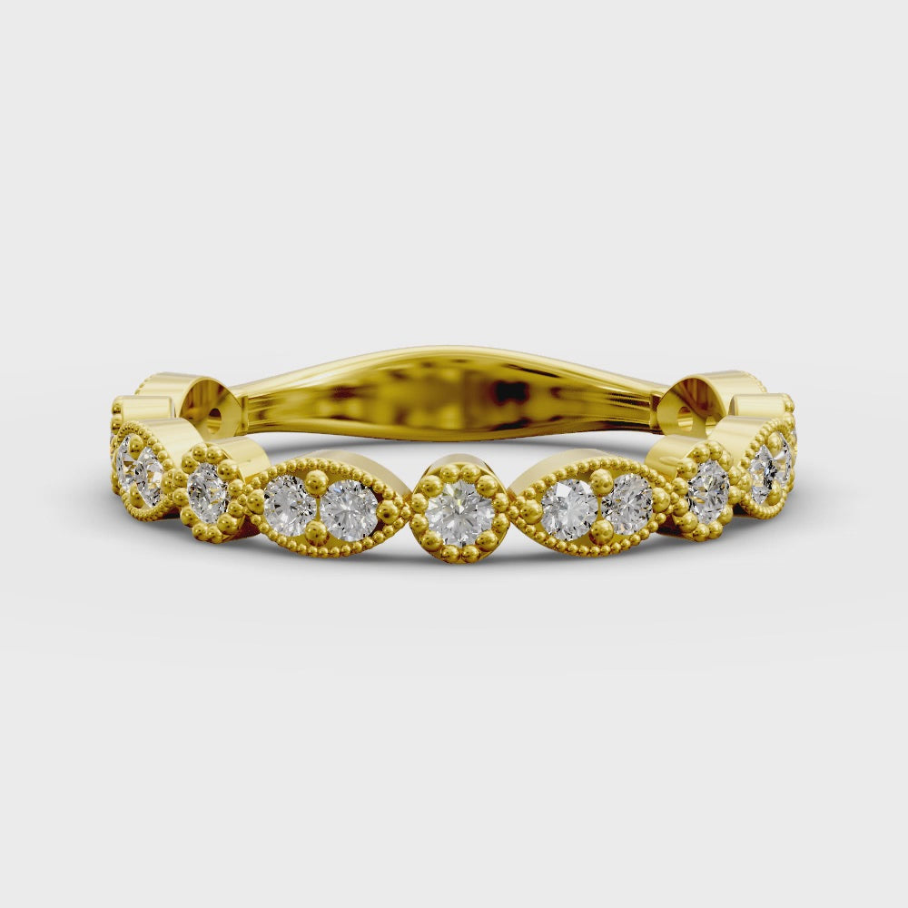 Diamond band with marquise and round bezels featuring vintage-style milgrain accents on a white background