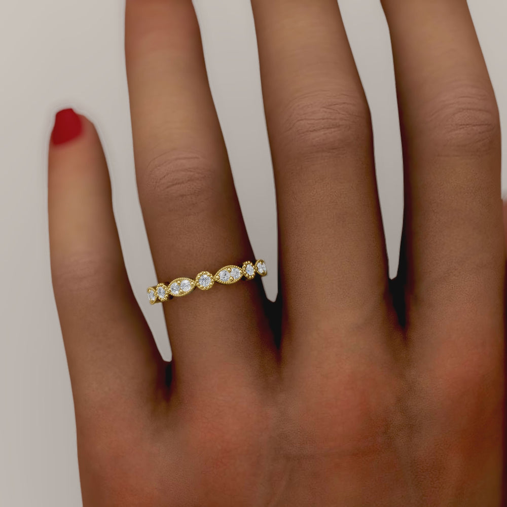 Diamond band with marquise and round bezels featuring vintage-style milgrain accents on a white background
