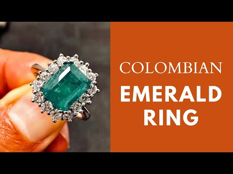1.25 CT Colombian emerald ring with 0.58 CT diamonds in 14K white gold.